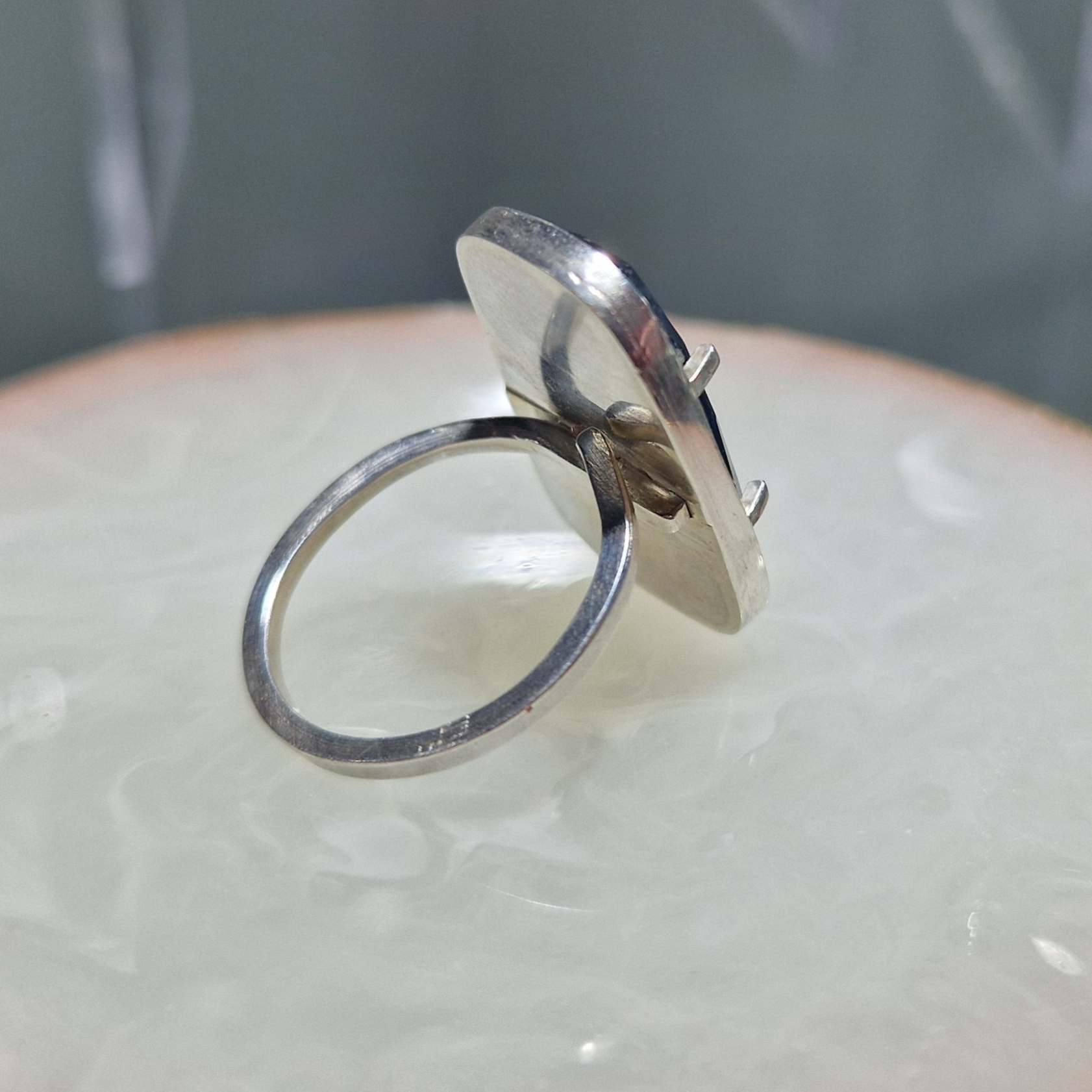 A silver ring set with a facetted Kyanite stone