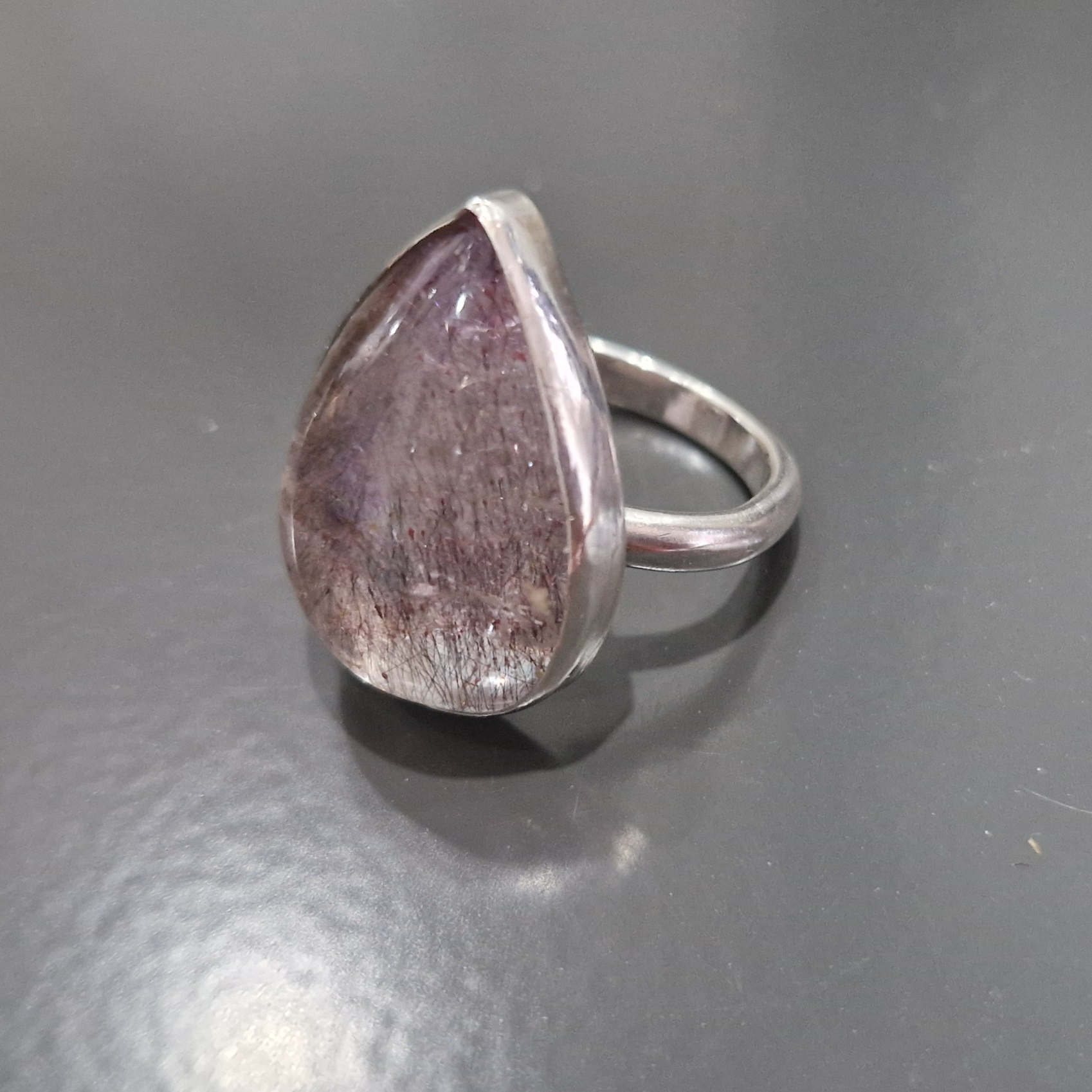A silver ring set with an amethyst rutile quartz - Julia Mathias Jewellery