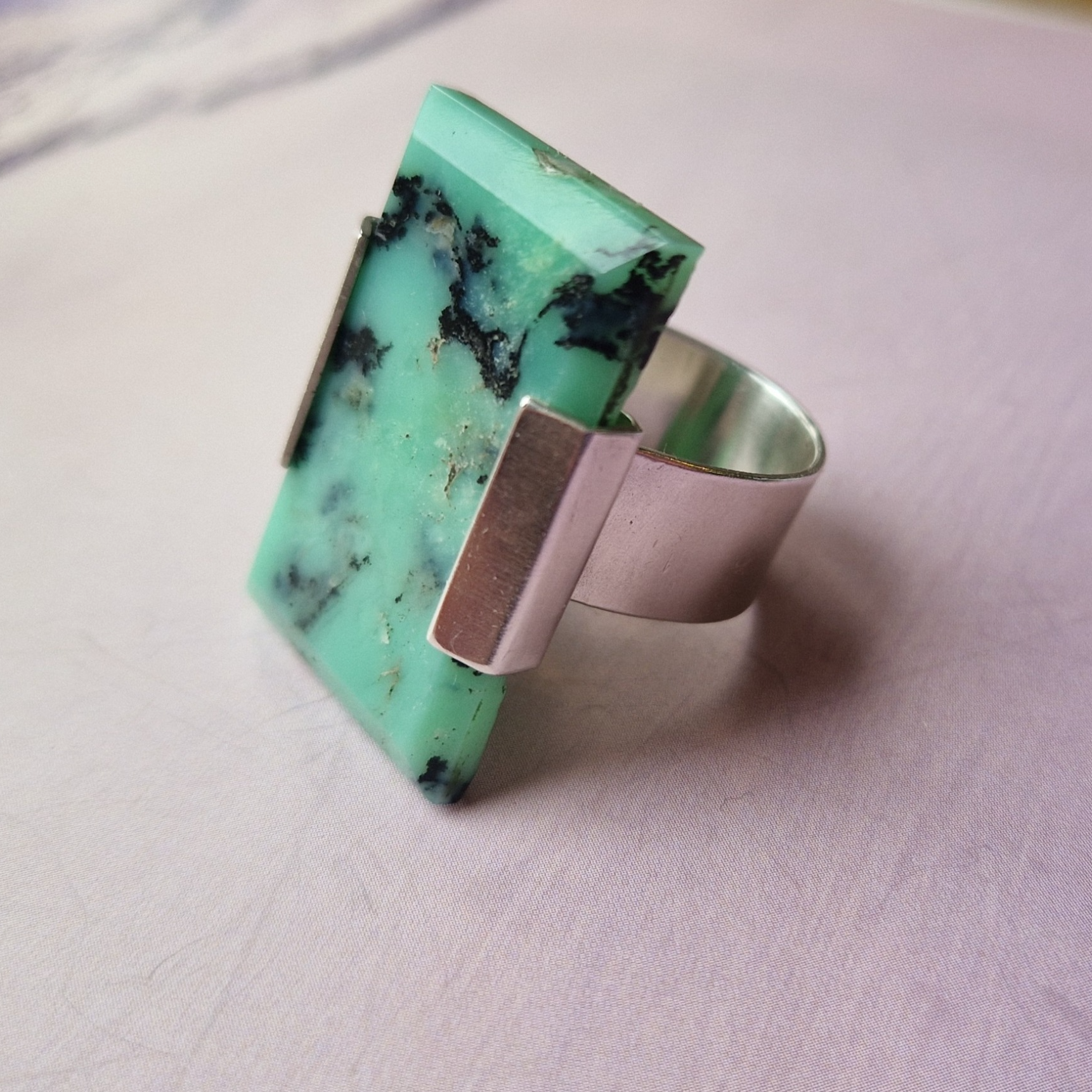Silver bracket ring with chocolate chrysoprase stone