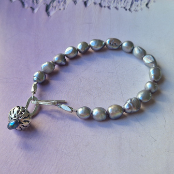 Grey lustre pearl bracelet with silver charm and clasp
