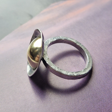 Silver ring with brass dome
