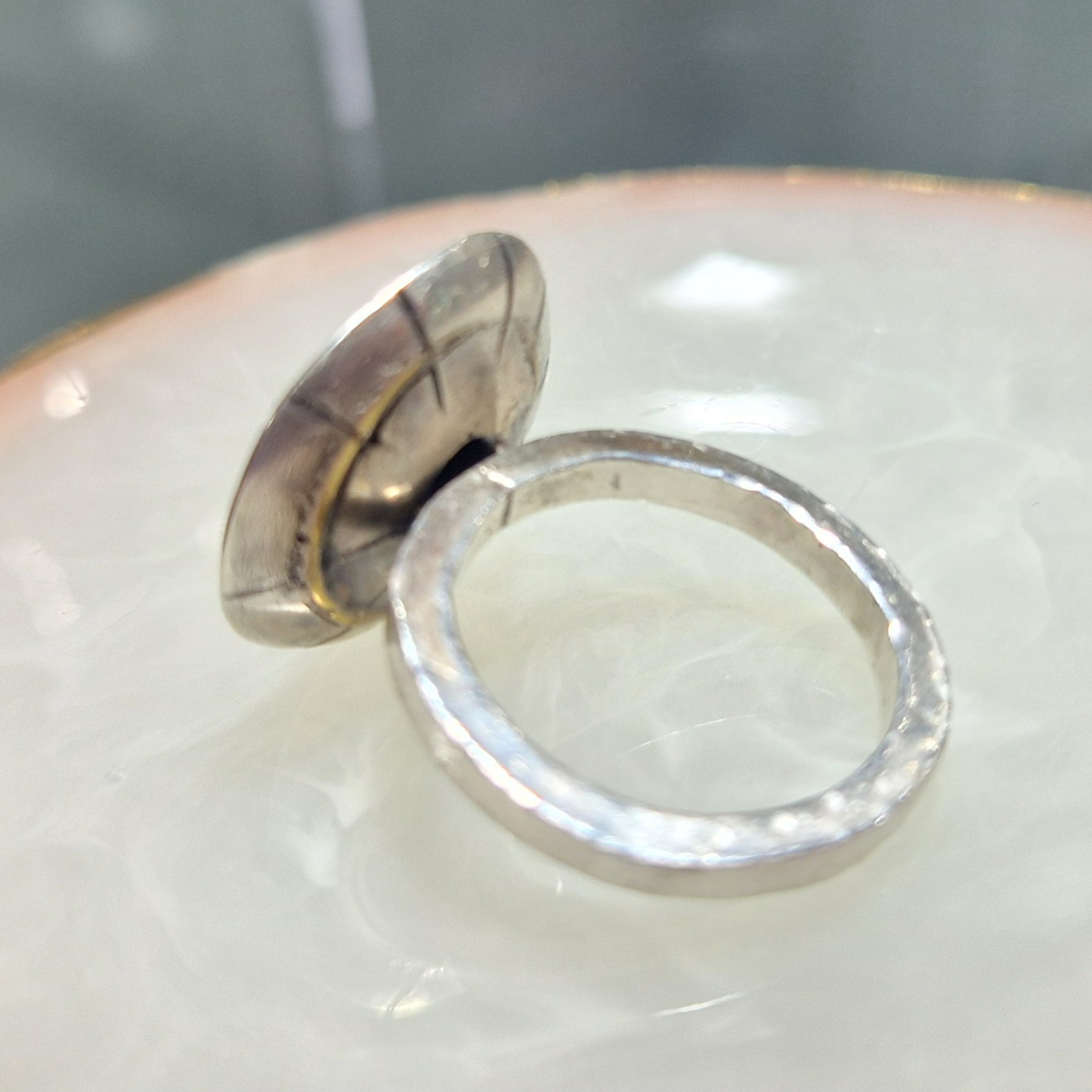 Silver ring with brass dome