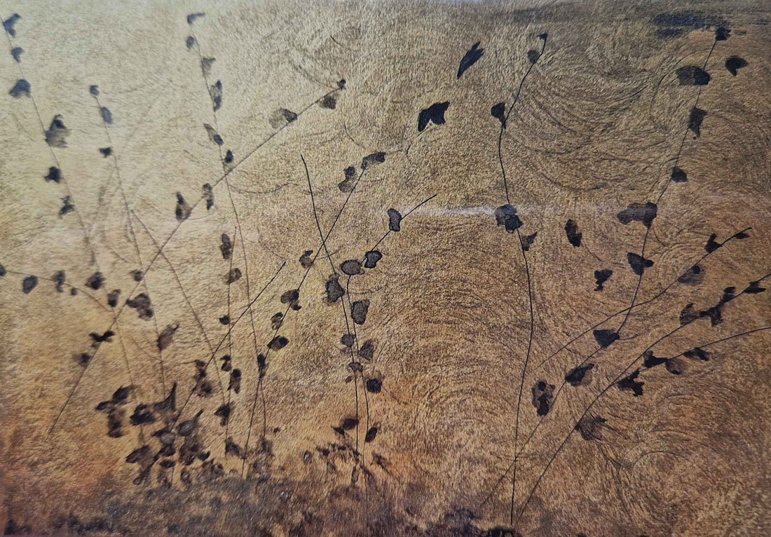 Black leaves on gold
